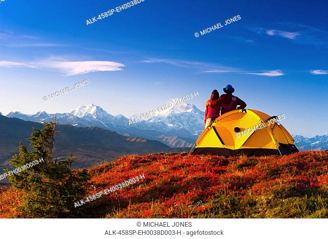 A couple view Mt.McKinley from their campsite in Peters Hills, Denali State Park, Southcentral Alaska, Fall/n