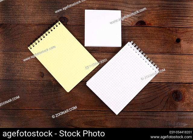 The different notebooks on a wooden table