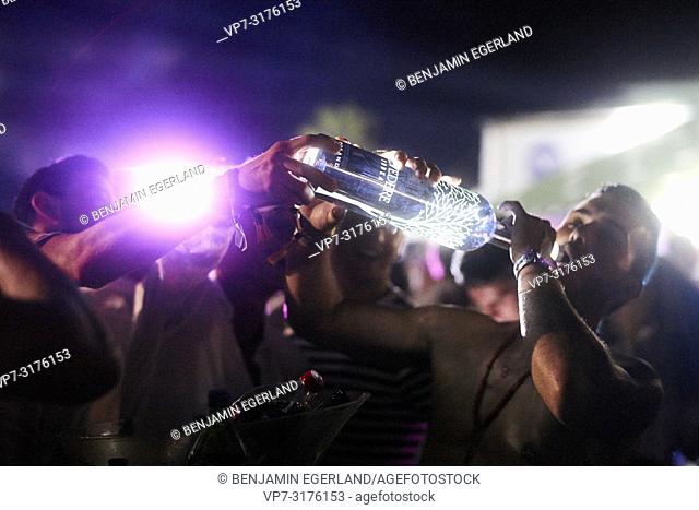 party people drinking Belvedere Vodka bottle at music festival Starbeach Chersonissos, Crete, Greece, at 06. August 2018