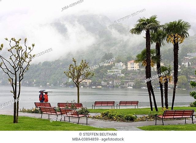 Switzerland, Lago Maggiore, Ascona, shore-promenade, persons out for a walk, rain, Europe, destination, lake, shore, promenade, lake-promenade, rainy weather