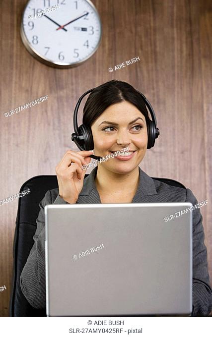 Business woman on telephone headset