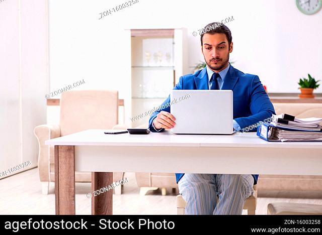 Young employee working from house in self-isolation concept