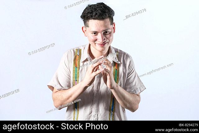 Cunning man rubbing his hands on isolated background, person rubbing his hands planning something, concept of cunning man planning something