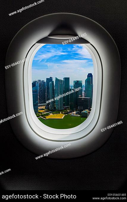 Singapore in airplane window - travel background