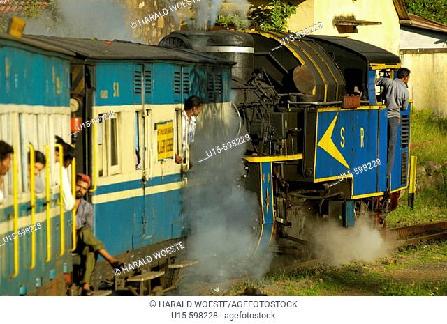 Nilgiri Mountain Railway pulled by it's steam engine 'Nilgiri Queen' on it's descent from Coonoor to Mettupalayam. Part of the journey is managed only by a...