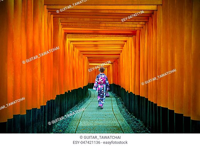 Asian women in traditional japanese kimonos at Fushimi Inari Shrine in Kyoto, Japan