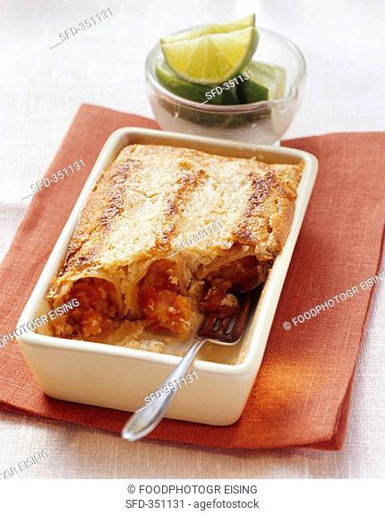 Sweet papaya-filled cannelloni with coconut flakes