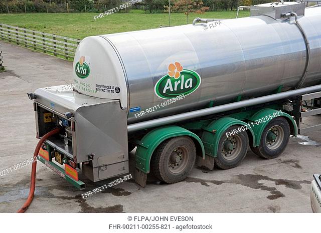 Arla milk tanker loading milk at dairy farm, Dumfries, Scotland
