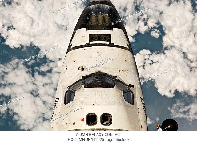 This view of the crew cabin of the space shuttle Discovery was provided by an Expedition 26 crew member during a survey of the approaching STS-133 vehicle prior...