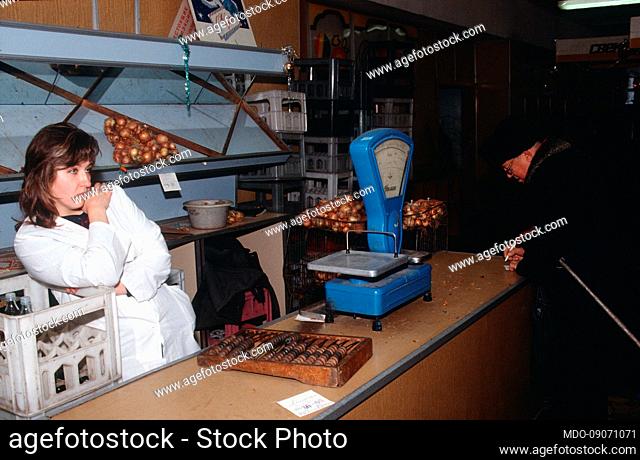 A grocery store with scales and abacus to do the math. Moscow (Russia), December 30th, 1991