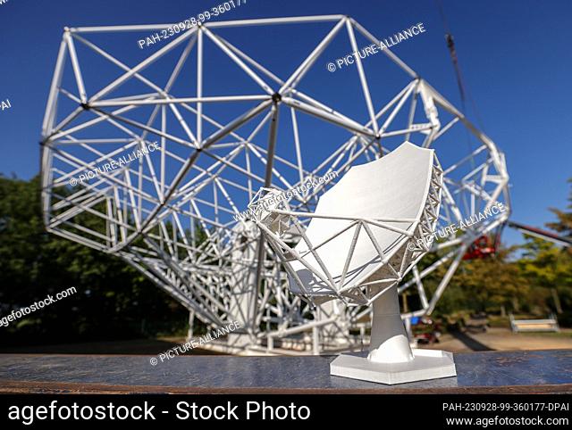 26 September 2023, Saxony, Schkeuditz: The model of an 18-meter parabolic antenna as part of what will be the world's largest radio telescope stands in front of...