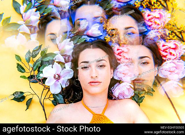 Multiple exposure of woman lying on flowers