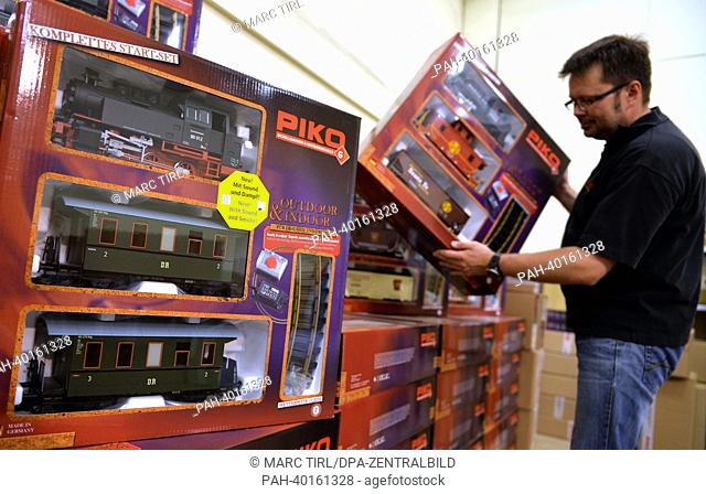 An employee presents a Spur-G-Starterset at a storage facility of model railroad manufacturer Piko in Sonneberg, Germany, 11 June 2013