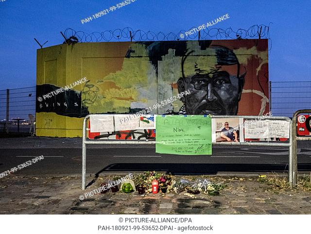 dpatop - 21 September 2018, Berlin: Craftsmen paint over the mural of the murdered habitual offender Nidal R. at Tempelhofer Feld. Nidal R