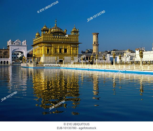 The Golden Temple with reflection in lake in foreground