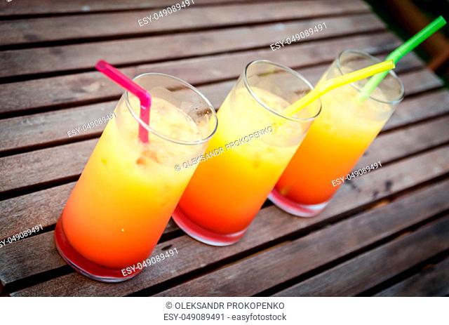 Three tequila sunrise cocktails