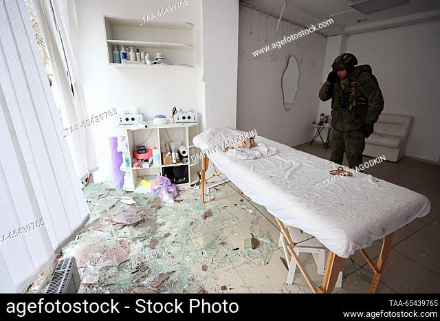 RUSSIA, DONETSK - DECEMBER 3, 2023: An officer of the Joint Centre for Control and Coordination of Issues Related to War Crimes of Ukraine (JCCC) inspects a...