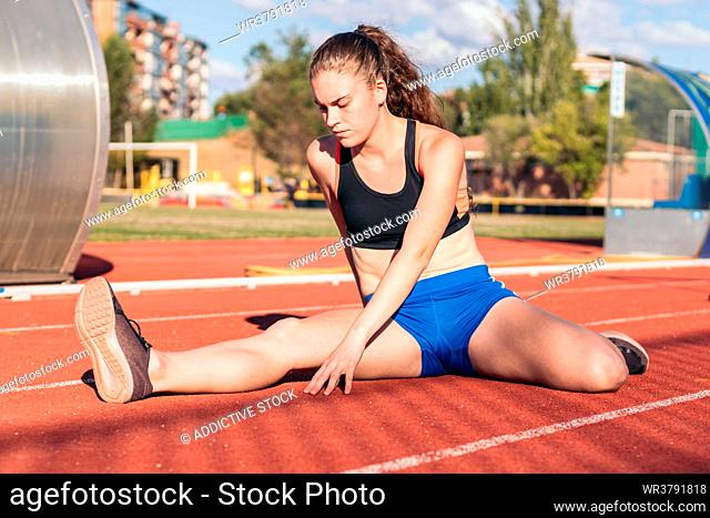 stretching, warming up, sportswoman