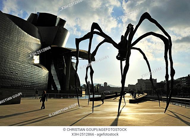 ''Maman'' sculpture by the French-American artist Louise Bourgeois 1911-2010 beside the Guggenheim Museum designed by architect Frank Gehry, Bilbao