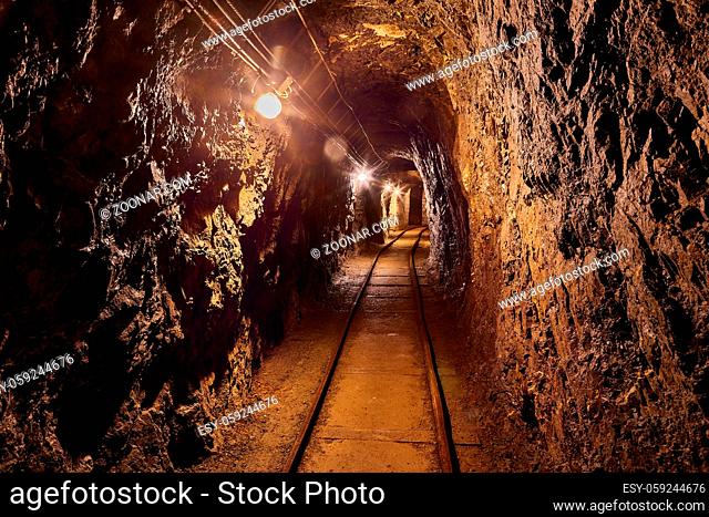 Mining tunnel with lights and rails