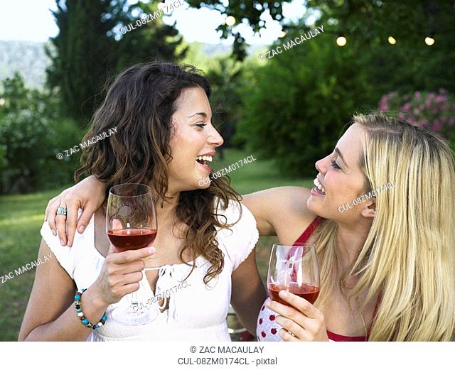 Two women laughing at barbecue