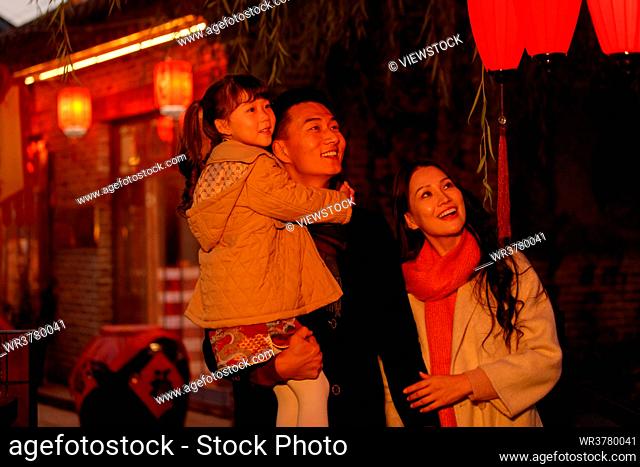 A family of three happiness temple fair