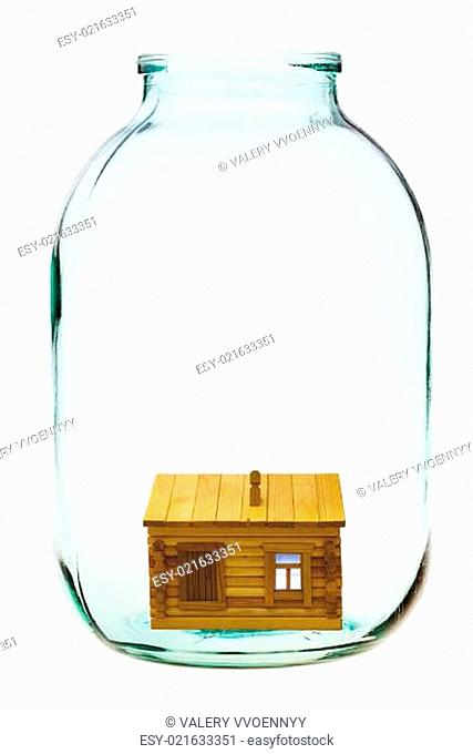 rural wooden house in big glass jar