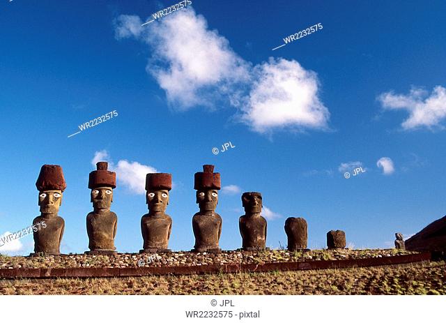 Chile, Ahu Nau Nau, Anakena beach, Easter Island, row of moai statues with Pukao(hats) Rapa Nui National Park, South America