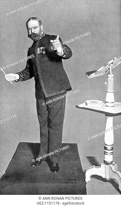 John Philip Sousa (1854-1932), American march composer and bandmaster, conducting his 'Washington Post'. Picture published London 1903