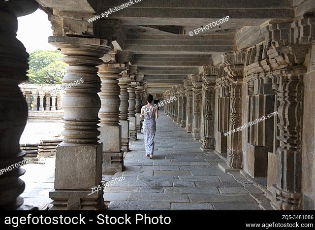 Somanathapura, Karnataka, India, November 2019, Tourist walking the corridors and carved pillars of the Chennakesava Temple