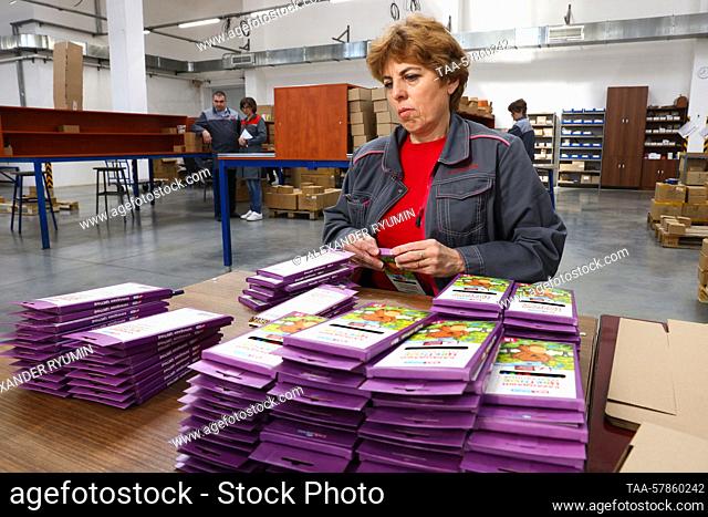 RUSSIA, RYAZAN REGION - MARCH 13, 2023: A woman packages colored pencils at Krasin Pencil Factory, a fully integraded manufacturer of all kinds of pencils