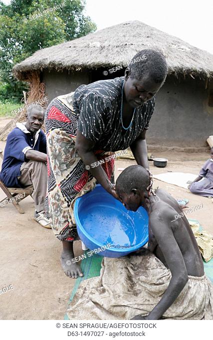 UGANDA    The work of Comboni Samaritans, Gulu  Visiting Atoo Alice, 48, who has AIDS and suffers from depression  She lives with her 52-year-old sister...