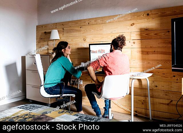 Young architects couple working at home
