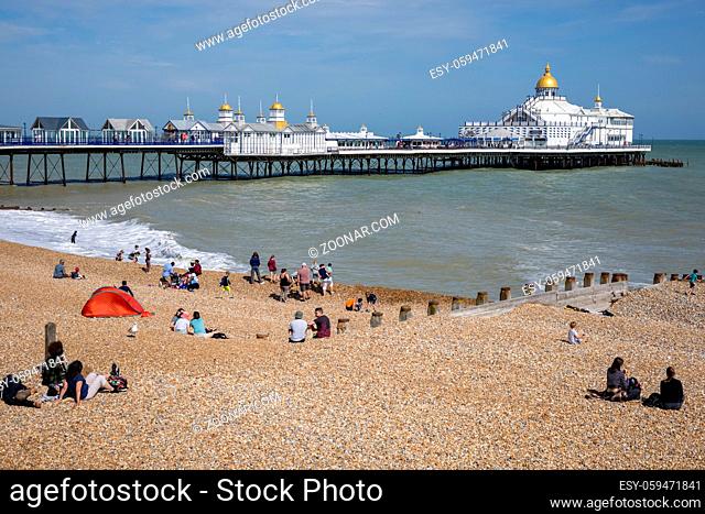 EASTBOURNE, EAST SUSSEX, UK - JULY 29 : View of Eastbourne Pier in East Sussex on July 29 2021. Unidentified people
