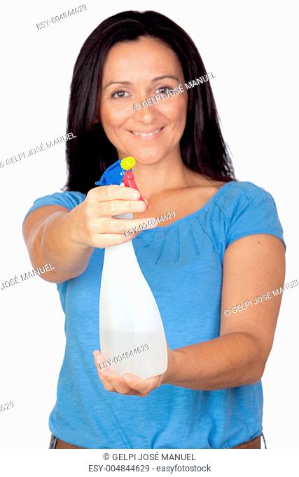 Adorable housewife with diffuser making cleaning with focus on