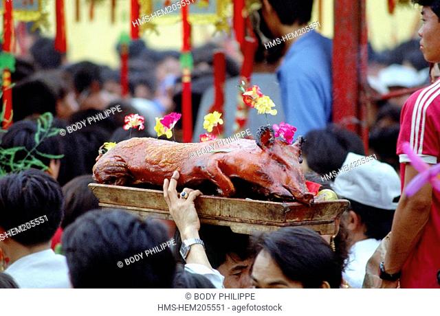 Vietnam, Saigon Ho Chi Minh City, Tet festival Vietnamese New Year, offering of a roasted pork