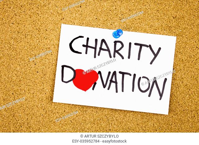 charity donation phrase handwritten on sticky note pinned to a cork notice heart symbol instead of O concept