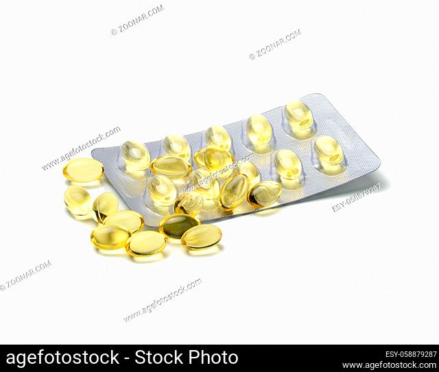 fish oil in capsules and blister pack on white background, food supplement for health, close up