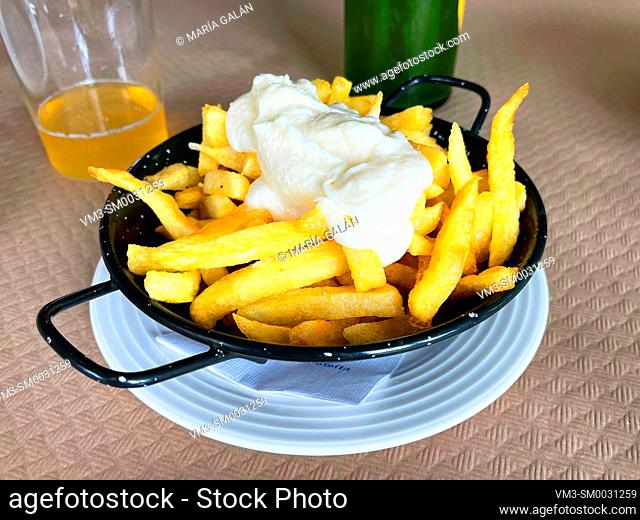Fried potatoes with alioli sauce. Spain