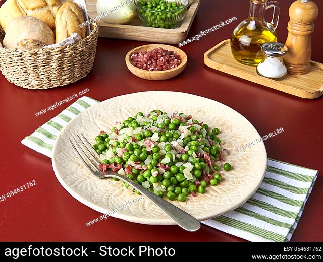 green peas and ham dish with ingredients and red background