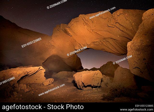 Starry night landscape of a volcanic Rock arch in Tenerife, Canary island, Spain