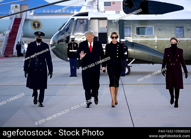 U.S. President Donald Trump, right, and U.S. First Lady Melania Trump board Air Force One during a farewell ceremony at Joint Base Andrews, Maryland, U