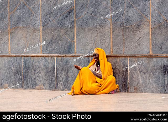AKSUM, ETHIOPIA, APRIL 27.2019, Resting orthodox priest in front of Church of Our Lady of Zion on April 27, 2019 in Aksum, Ethiopia, Africa