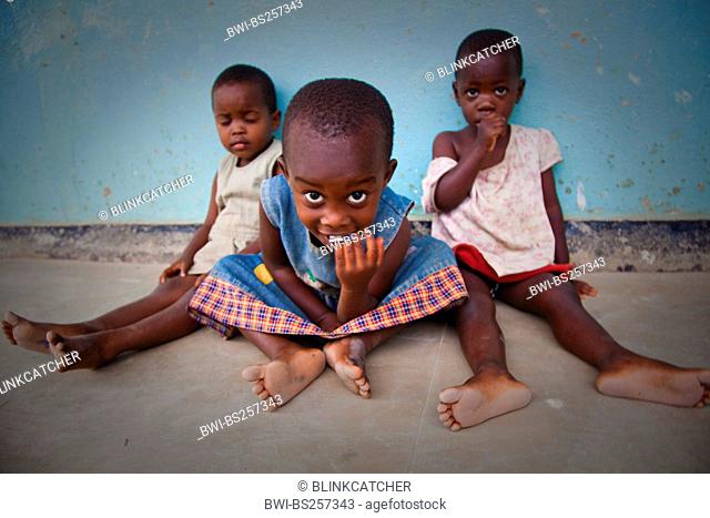 three little girls sitting on the floor of an orphanage, Burundi, Bujumbura Mairie, Bujumbura