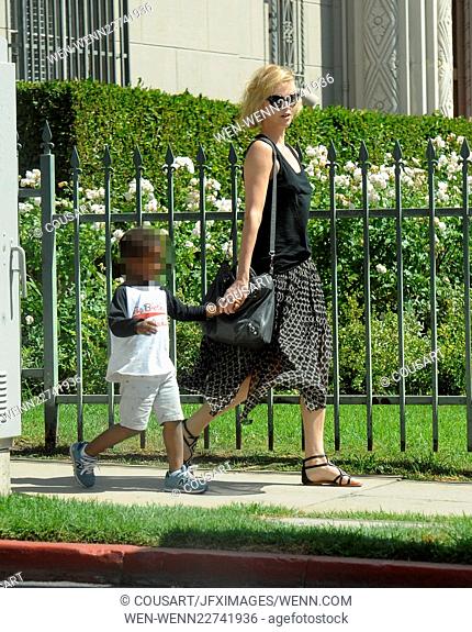 Actress Charlize Theron heads to a friends in Los Angeles house with son Jackson after news of her adopting a baby girl. Featuring: Charlize Theron