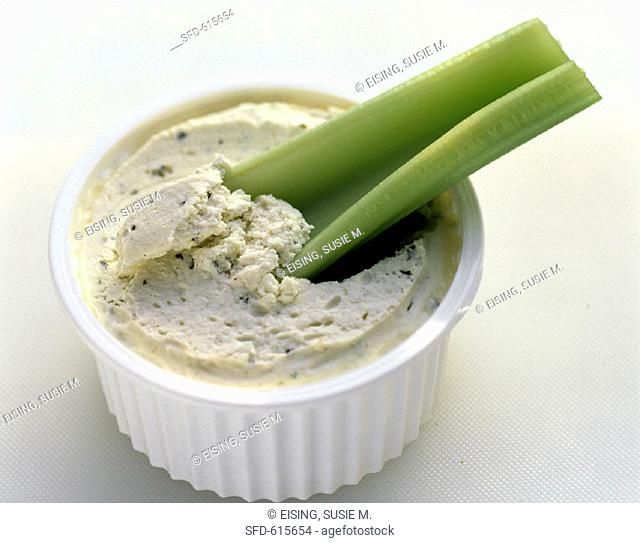 A Celery Stick in a Bowl of Vegetable Dip
