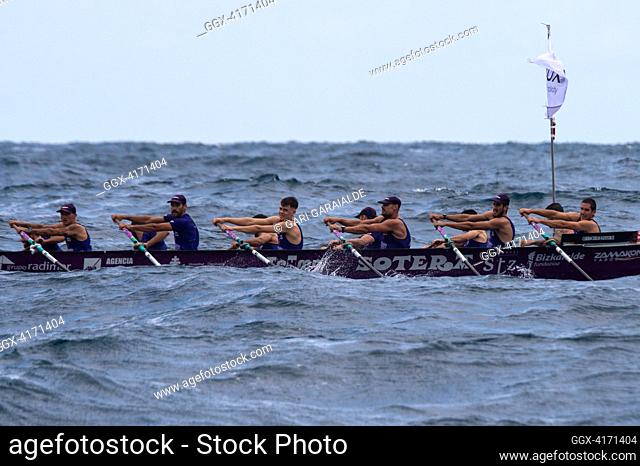Crew of Santurtzi rowing boat in action during XIV. Getariako Ikurrina men’s regatta of the ACT League (The Association of Clubs of rowing boats)