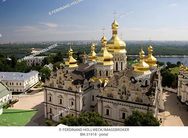 Ukraine Kiev the monastery of cave Kyjevo Pecers'ka Lavra view to Uspens'kyj Cathedral with 7 golden domes crosses blue sky river Dnepr at background 2004