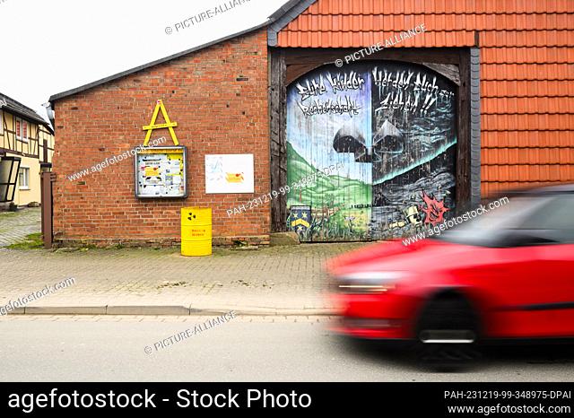 19 December 2023, Lower Saxony, Salzgitter: A graffiti with the words ""Your children will hold you accountable"" and a nuclear sign can be seen on a barn in...