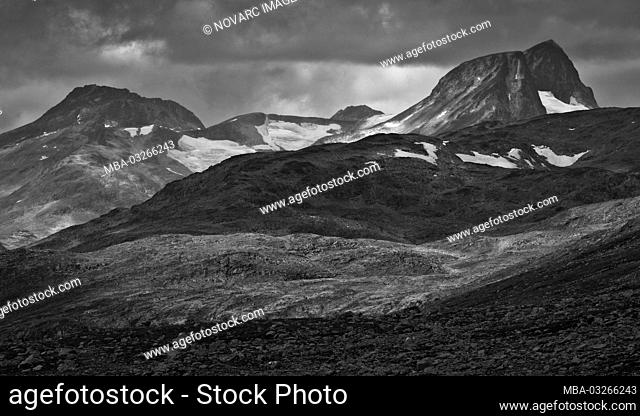 Mountain range with low hanging clouds, Jotunheimen National Park, Norway